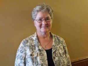 Doctor Susan Graham smiling in her office at Sandusky Wellness Center